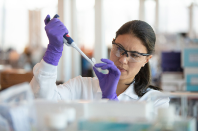 female scientist conducting an experiment in a lab