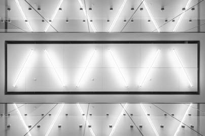 Bright light tubes against a silver wall