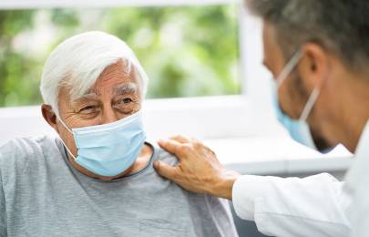 Doctor speaking to senior patient