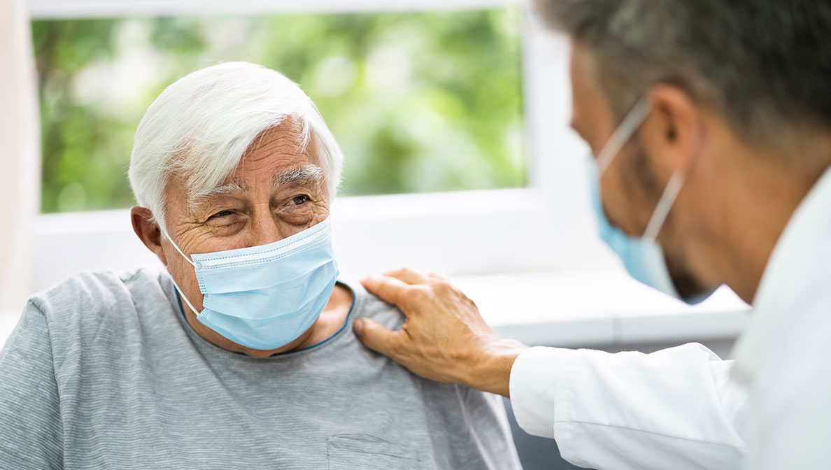 Doctor speaking to senior patient