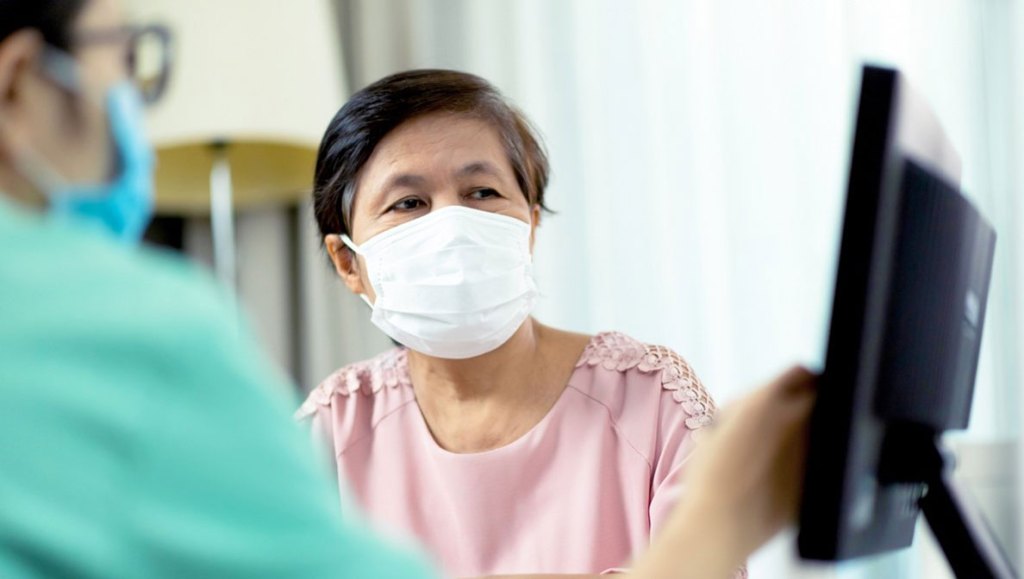 woman patient wearing a mask