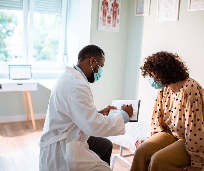 doctor speaking to patient