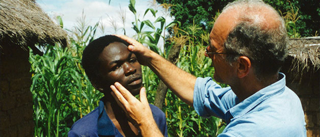 a doctor checking eyes for river blindness