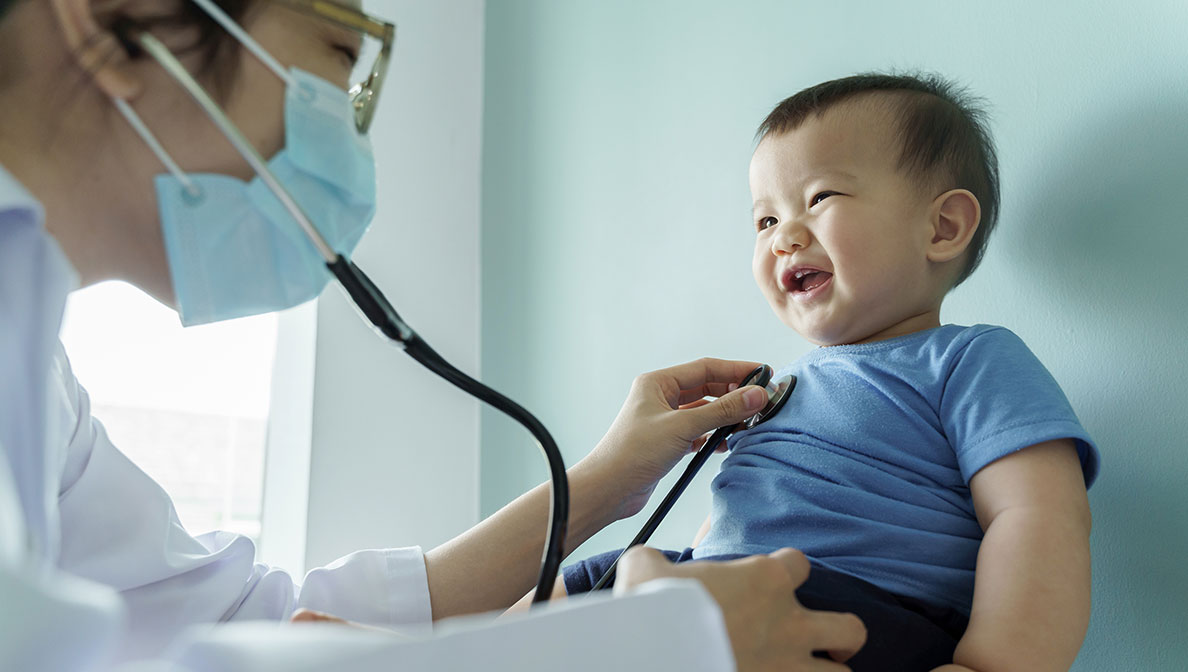 baby being examined by a doctor