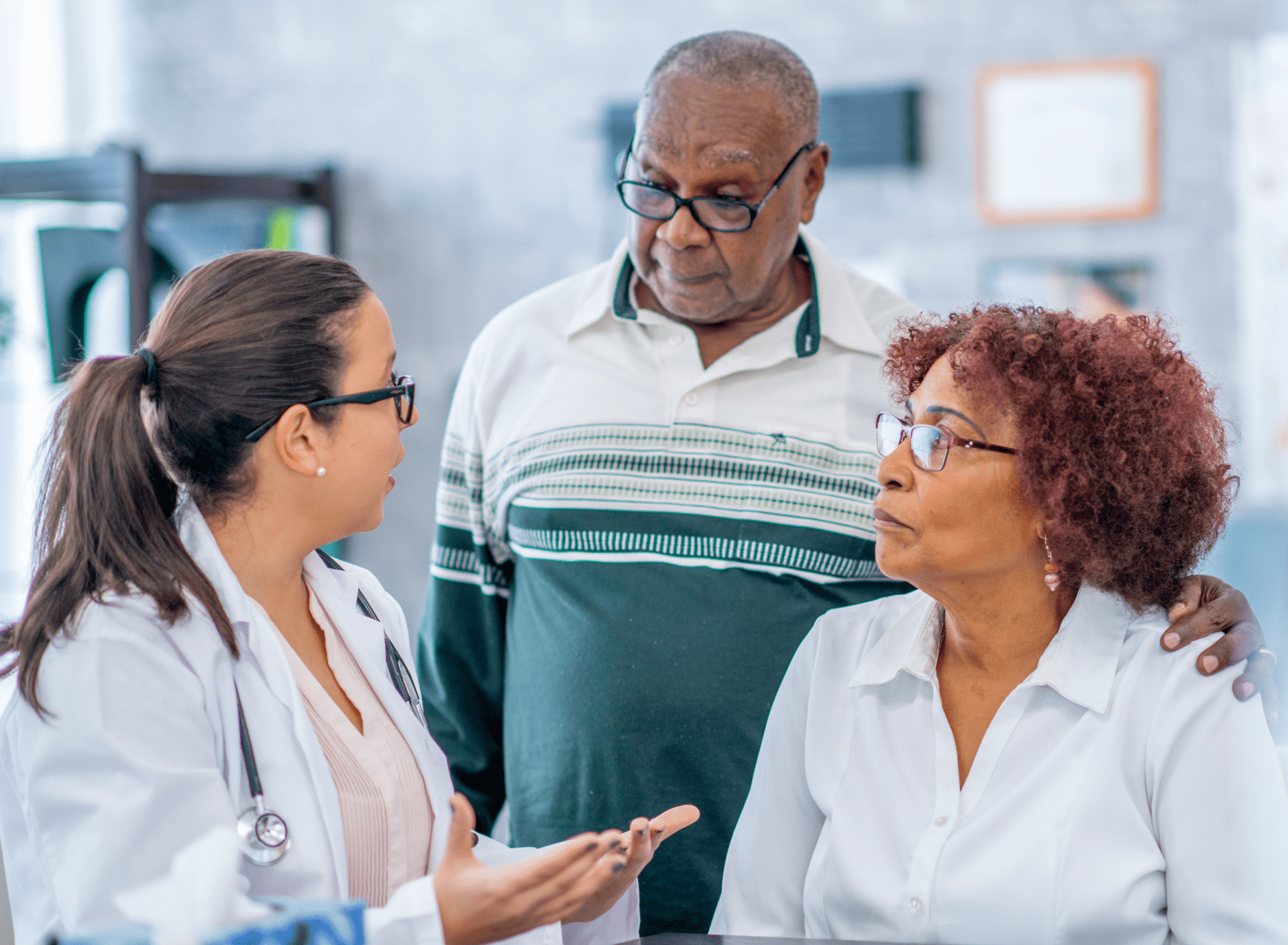 health care provider talking with older man and woman