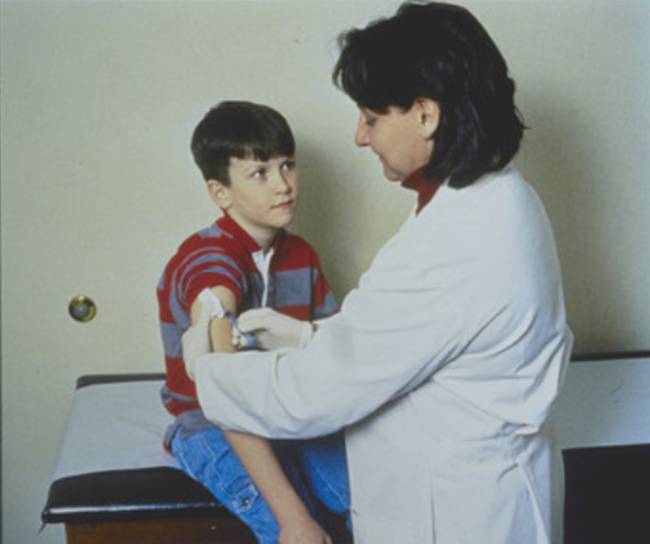 doctor holding patients right arm