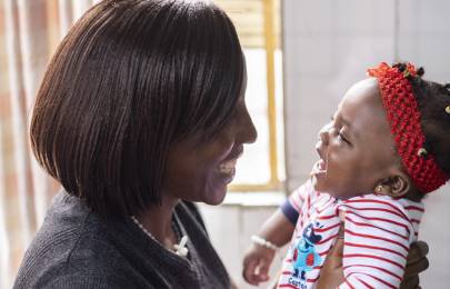mom and baby smiling at each other
