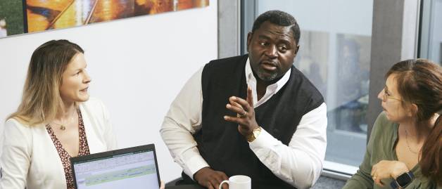 three people talking