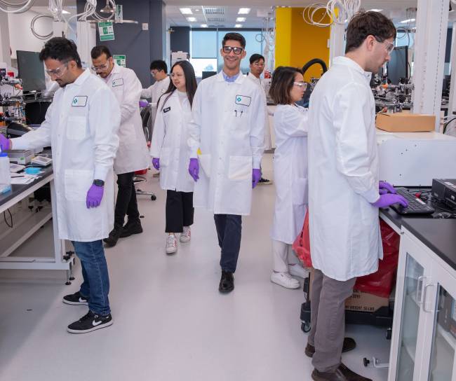 Photo of a number of scientists in a lab