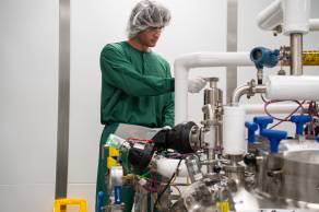 Scientist adjusting tubes