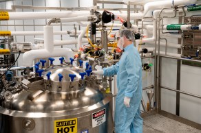 Scientist checking a centrifuge