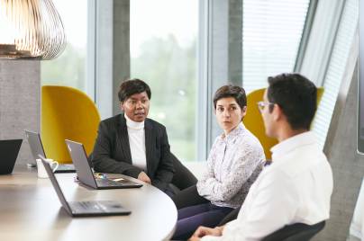 Three people in a meeting