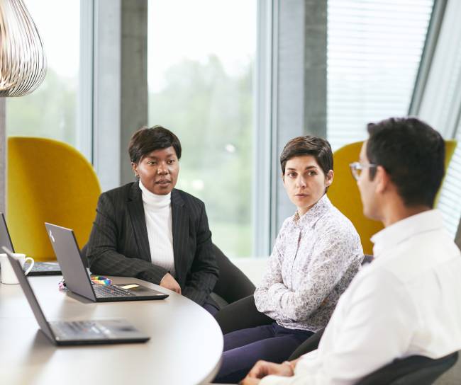 Three people in a meeting