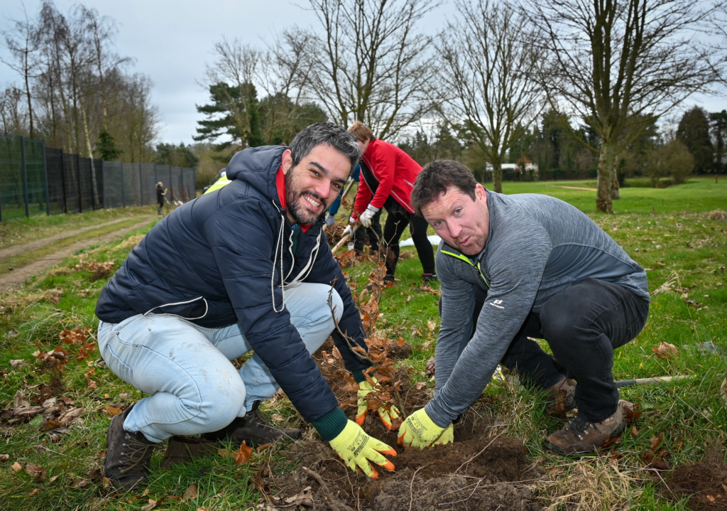 group of people planting trees