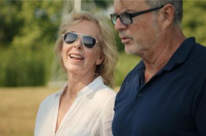 a man and woman smiling and talking