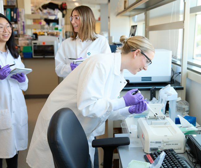 Three scientists working in our Boston lab