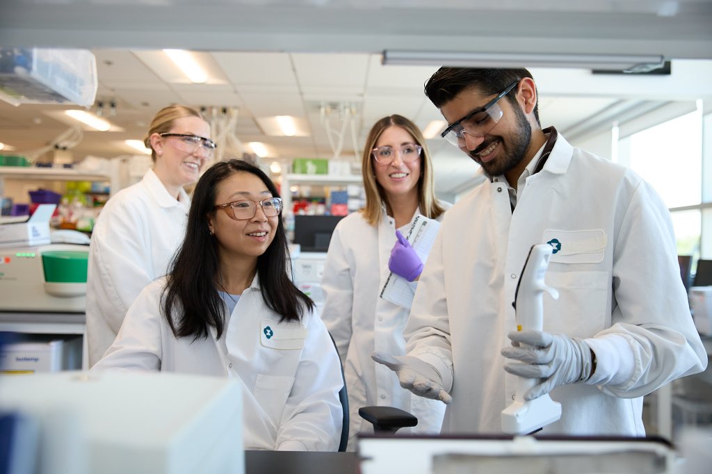 four scientists working in our Boston lab