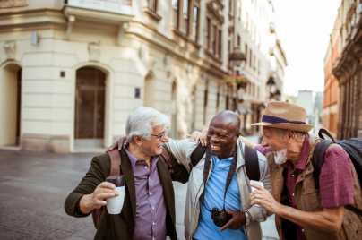 three men walking, talking and laughing