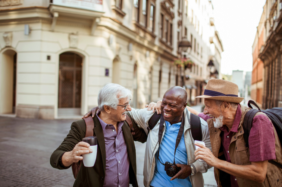 three men walking, talking and laughing