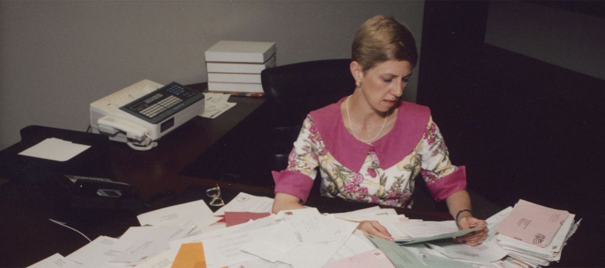 Linda Distlerath sits at desk