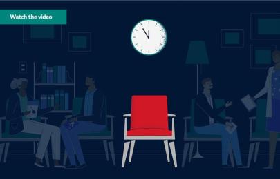 Red chair with clock above it and shadows of patients in the background