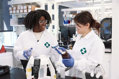 two scientists talking in a lab