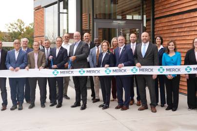 large group of Merck leaders at West Point, PA, ADVANCE facility ribbon cutting