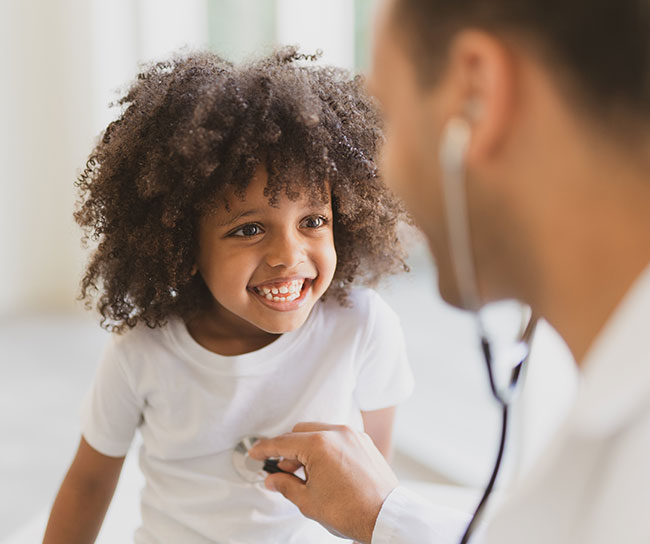 doctor doing a check up on a child