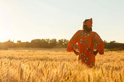 African woman standing in a field