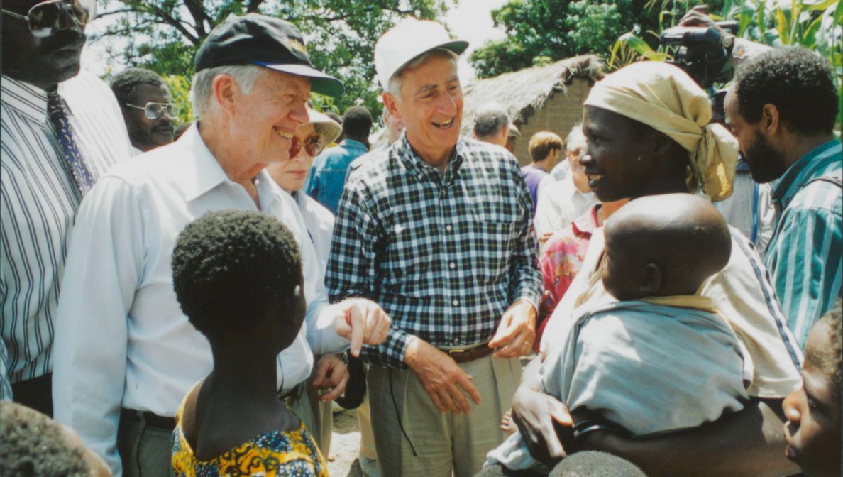 Former President Jimmy Carter and retired Merck CEO Roy Vagelos meet with people affected by river blindness