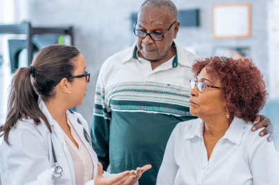health care provider talking with older man and woman