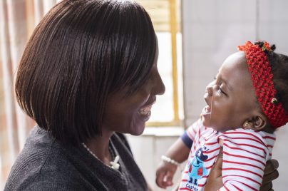 mom and baby smiling at each other