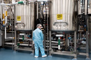 Person standing in front of vats